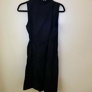 Black wrap dress with ruffles.